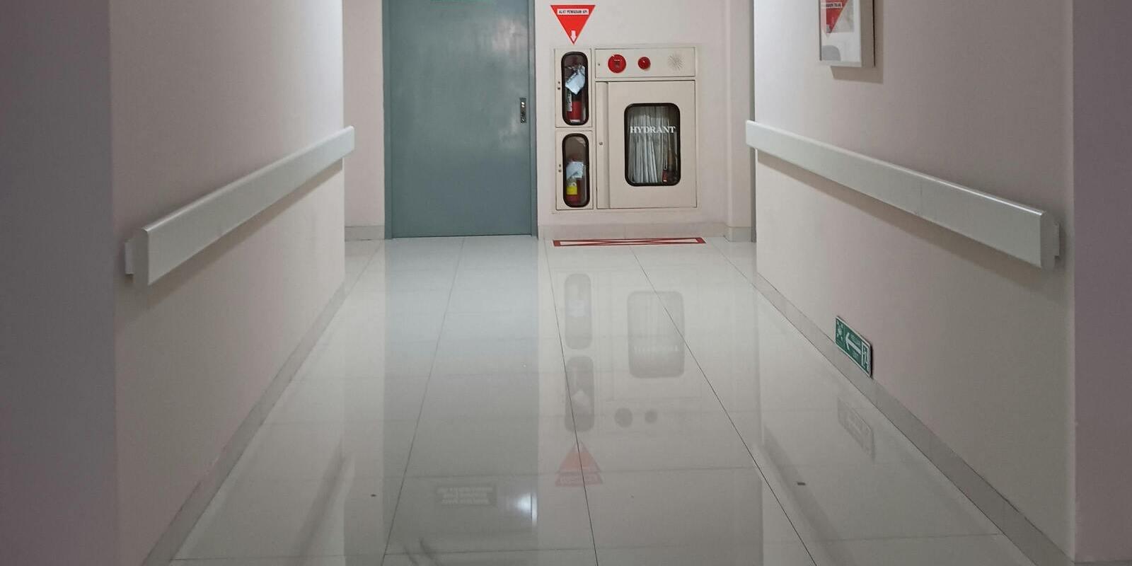 Polished tile floor in a hospital corridor