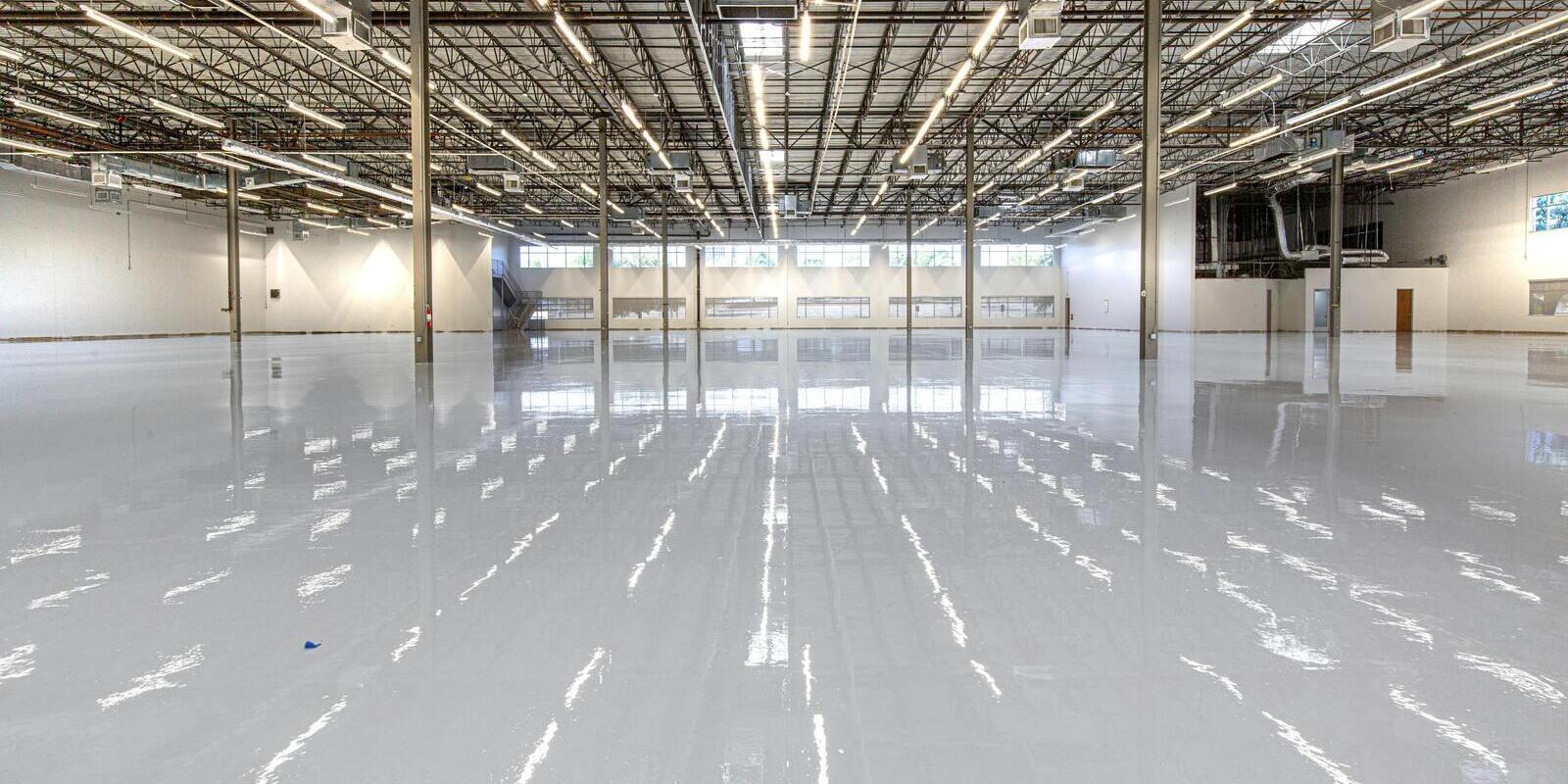 High-gloss finished floor across an open big-box retail space