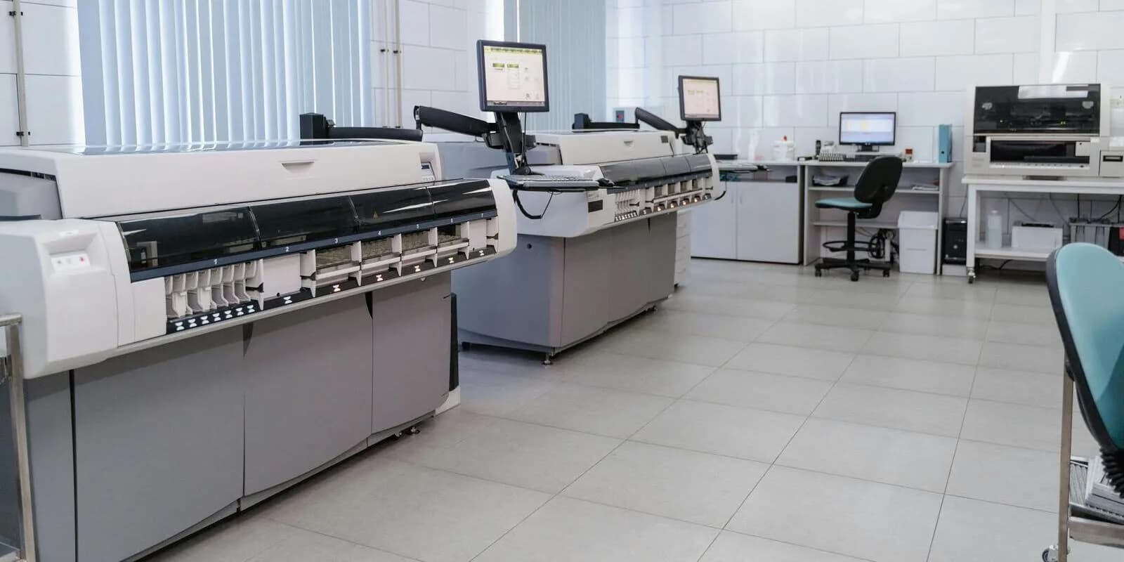 A medical laboratory with diagnostic analyzer machines and clinical workstations