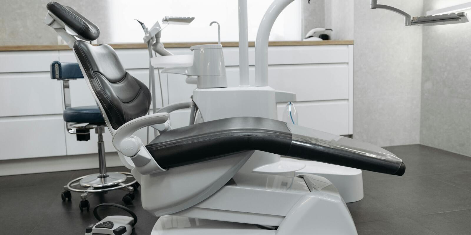 Leather-upholstered dental chair in a clinical treatment room